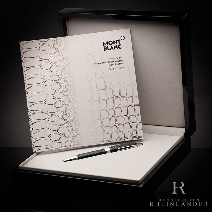 Schwarz-silberner Rollerball aus Alligatorleder in Editionsbox liegend, daneben Serviceguide