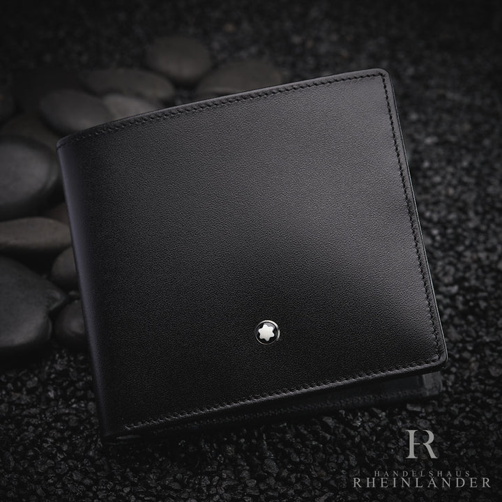 Montblanc Portemonnaie aus schwarzem Leder auf dunklem Kies