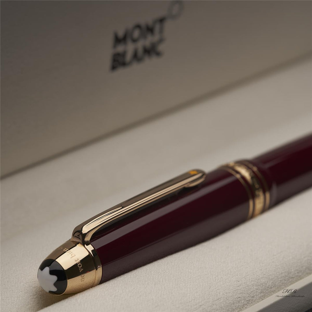 roter Montblanc Petit Prince Planet LeGrand Rollerball liegend mit Kappe voran in der Originalverpackung