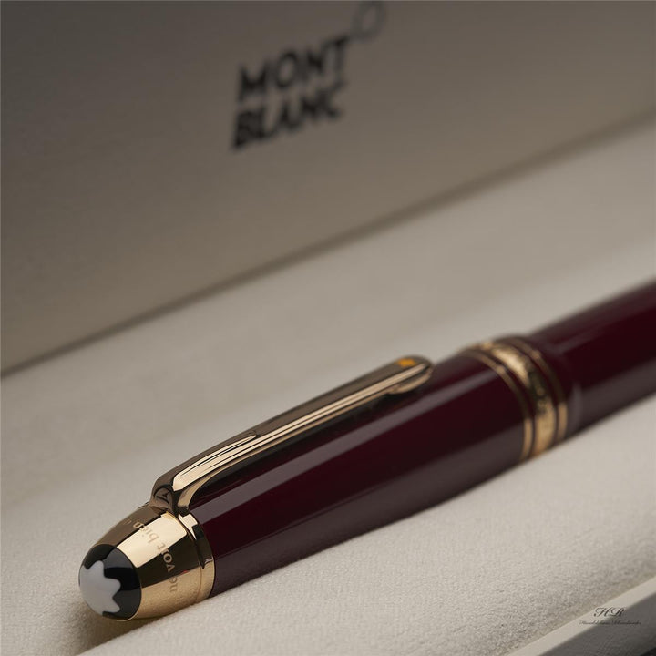 roter Montblanc Petit Prince Planet LeGrand Rollerball liegend mit Kappe voran in der Originalverpackung