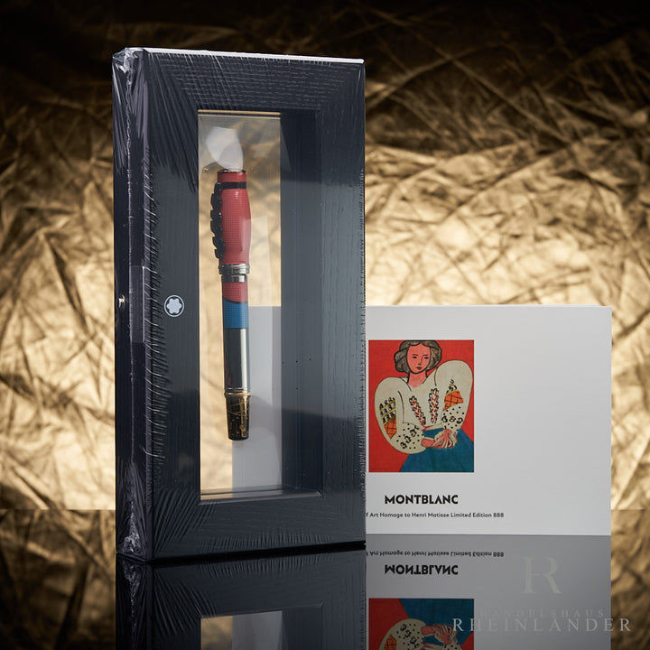 bunter Montblanc Matisse Füllfederhalter in Membranbox eingeschweißt stehend mit Service Guide vor goldenem Hintergrund