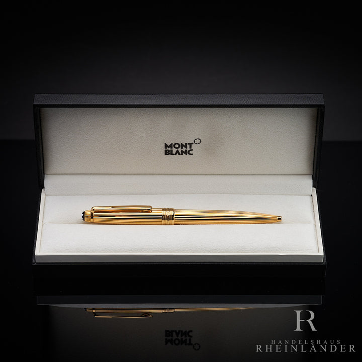 Vergoldeter Montblanc Kugelschreiber mit Nadelstreifen Guillochierung liegt in offener Originalverpackung 