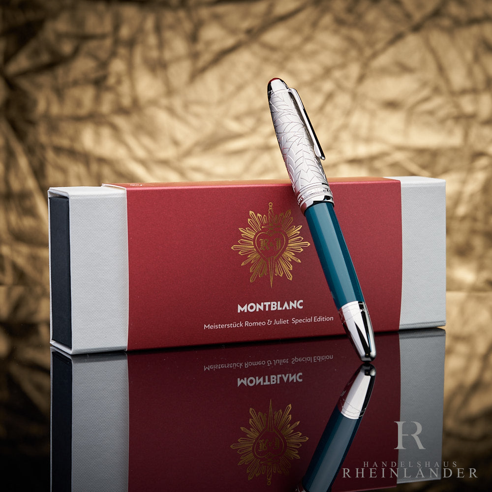 Montblanc Doue LeGrand Romeo & Juliet Rollerball angelehnt an die Originalverpackung vor goldenem Hintergrund