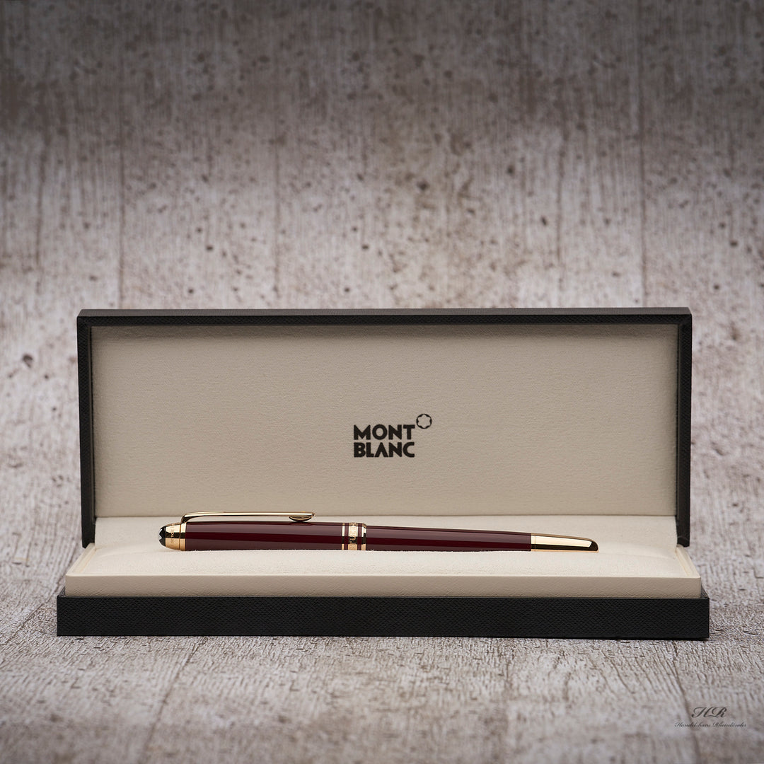 bordeauxroter Montblanc Petit Prince Rollerball mit goldenen Beschlägen liegend in der Originalverpackung 
