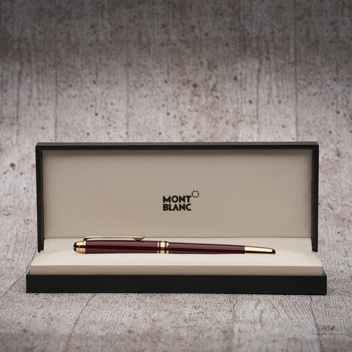 bordeauxroter Montblanc Petit Prince Rollerball mit goldenen Beschlägen liegend in der Originalverpackung 