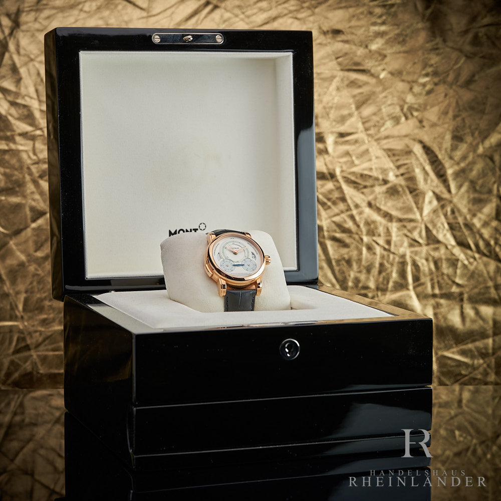 Uhr mit schwarzem Band und goldenem Gehäuse wird in schwarzer Originalbox vor goldenem Hintergrund präsentiert